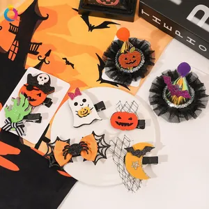 Detail of Halloween hair clips featuring pumpkin, ghost, and spider web sequin designs