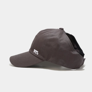 Detail of grey ponytail baseball cap with DYL embroidery and large back opening