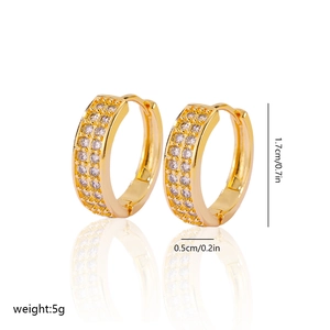 Detail view of gold zircon earrings with 1.7cm height and 0.5cm thickness dimensions