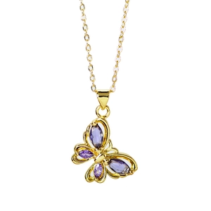 Close-up of gold butterfly necklace pendant with purple gemstones on a white background