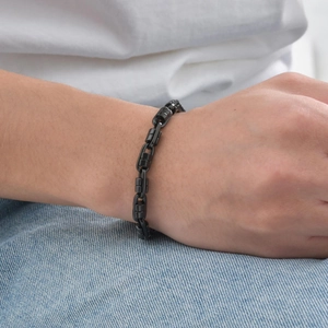 Men's minimalist black stainless steel link chain bracelet on wrist model display