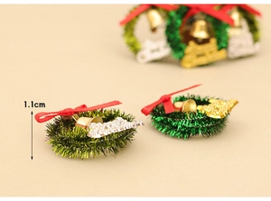 Detailed macro view of 1.1cm miniature Christmas dollhouse wreath with festive red bow