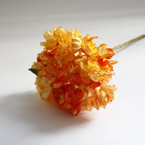 Macro shot of orange silk hydrangea flower petals with realistic vintage burnt edges