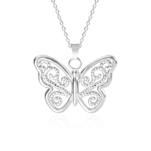 Macro detail of silver stainless steel butterfly pendant with intricate filigree cutouts
