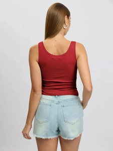 Detailed back view of a red slim fit ribbed tank top paired with denim shorts