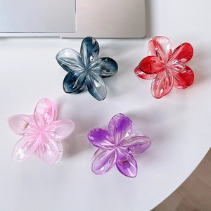 Set of four gradient plumeria hair claws in blue, red, pink, and purple acrylic colors