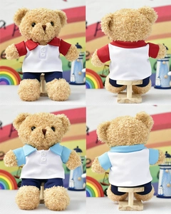Detailed view of teddy bear plush toys wearing red and blue polo shirts and navy shorts