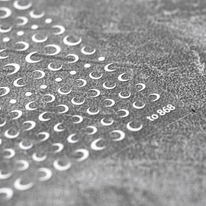 Macro detail of model 868 nail art stickers featuring white crescent moons and dots