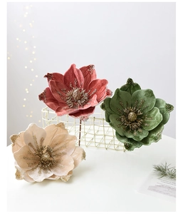 Detail of premium velvet magnolia flowers with gold glitter for Christmas tree decor