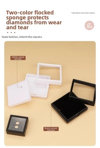 Detail of square acrylic jewelry box with black and white memory foam inserts
