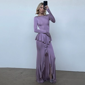 Detail of elegant purple long-sleeve dress with ruffled hem and slim fit silky fabric