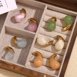 Colorful resin teardrop earrings in 18K gold-plated setting displayed in a wooden jewelry box