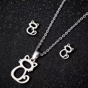 Elegant silver stainless steel cat necklace and earrings jewelry set on black background
