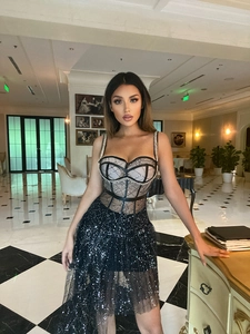 Close-up of black sequin embroidery and sheer mesh detail on a sexy party bodycon dress