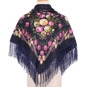 Detailed view of 90x90 ethnic scarf with pink and yellow floral prints and tassel fringe