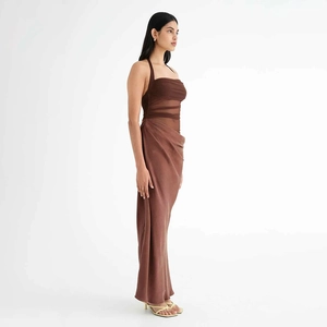 Detail of brown halter neck dress with mesh splicing and pleated bodice design