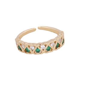 Golden butterfly heart open ring with green gems and white zircons on white background