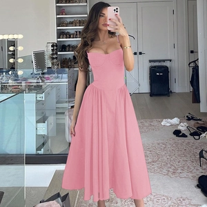Pink backless midi dress with slim waist design shown in an indoor selfie view