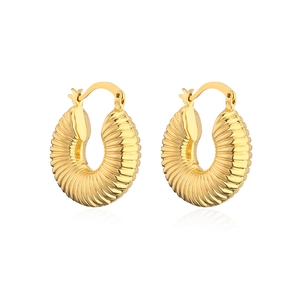 Macro detail of French style golden ridged hoop earrings with a textured metal finish