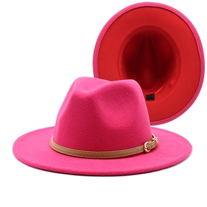 Detail of rose red wool fedora hat with red lining, leather band and metal buckle