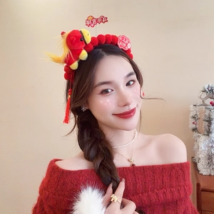 Detail of red festive plush headband with lion dance doll and lucky tassel for New Year
