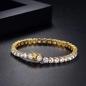 Classic golden tennis bracelet with round-cut zircon stones on a black background