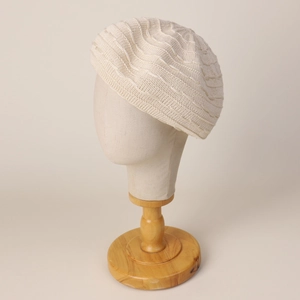 Chic beige knit beret with elegant wavy textured pattern for women's casual fashion