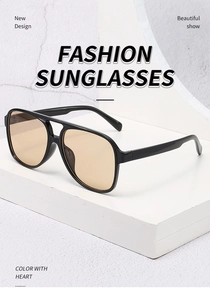 Detail of vintage aviator sunglasses with black large frames and yellow tinted lenses