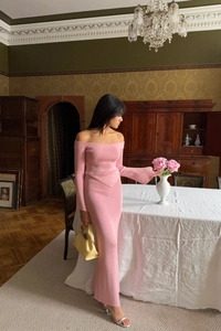 Detail of pink off-shoulder knitted two-piece set featuring fine ribbed texture and slim fit