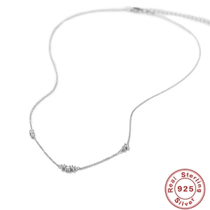 Elegant S925 sterling silver necklace with triple diamond accents on white background
