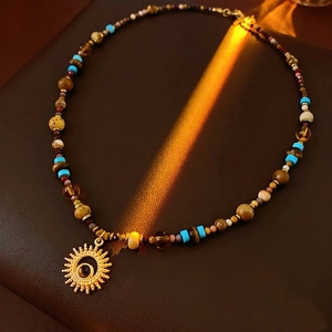 Bohemian titanium steel necklace with sun pendant, natural stones and turquoise beads