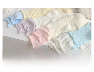 Detail showing pastel macaron color palette and ruffled cuffs of cotton crew socks
