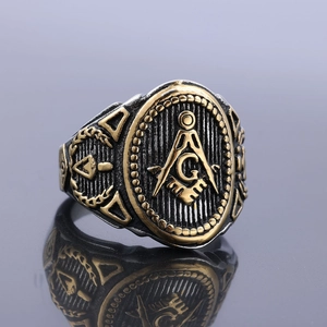Macro view of vintage Freemason signet ring with silver and gold finish detailing