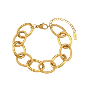 Detail of gold chunky link bracelet featuring K18 engraved tag and lobster clasp
