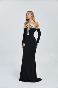 Detail of cross halter neck with hand-stitched pearls and sequins on black evening gown