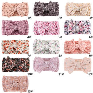 Set of 13 soft infant nylon headbands with assorted floral and polka dot patterns