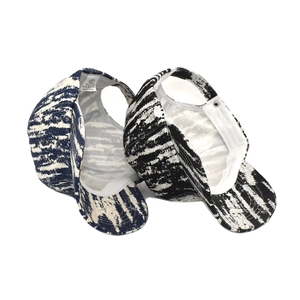 Unisex tie-dye baseball cap in 100% cotton, showing front and interior tag views