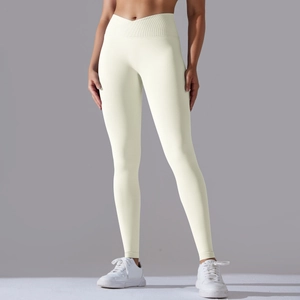 Detail view of cream high-waisted yoga leggings with ribbed V-cross waistband