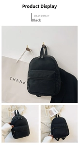 Detailed view of black nylon mini backpack featuring durable fabric and zippered pockets