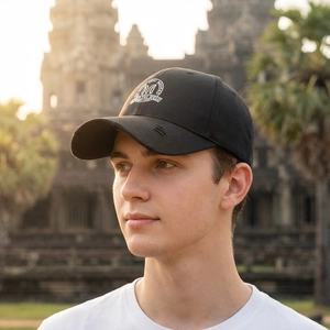 Black cotton baseball cap with vintage distressed brim and white embroidered logo patch