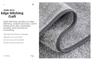 Detail of grey coral fleece towel showing reinforced edges and high-density stitching