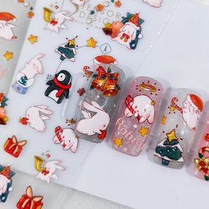 5D Christmas bunny nail stickers with Santa and glitter accents on white background