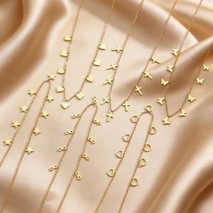 Gold stainless steel necklace set with heart, star, cross, and butterfly charms