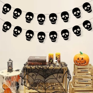 Halloween decorative banner featuring black cutout skull silhouettes for party wall decor
