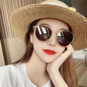 Women's vintage round oversized sunglasses with gold metal frame and gradient brown lenses