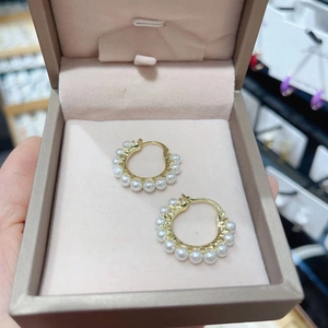 Elegant gold pearl hoop earrings for women featuring white pearls in a jewelry gift box