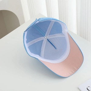 Detail view of internal seams and white sweatband inside the shark baseball cap