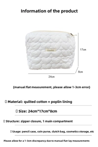 Quilted cotton makeup bag detail showing white heart pattern and 24x17x8cm dimensions
