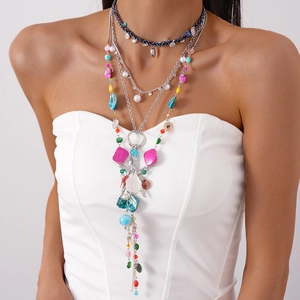 Detail of bohemian layered necklace with colorful beads and starfish shell charms