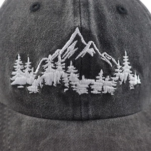 Vintage dark gray washed cotton baseball cap featuring mountain and forest embroidery